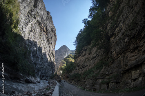 Cycling mountain road. Misty mountain road in high mountains.. Cloudy sky with mountain road. Summertime