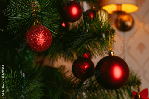 Christmas toy on the Christmas tree. Decorated Christmas tree ball. Christmas ball close up. Selective focus.