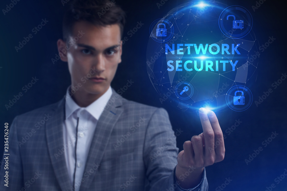 The concept of business, technology, the Internet and the network. A young entrepreneur working on a virtual screen of the future and sees the inscription: Network security The concept of business, technology, the Internet and the network. A young entrepreneur working on a virtual screen of the future and sees the inscription: Network security