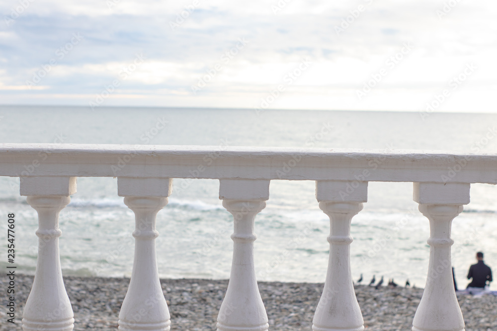White parapet on the seafront overlooking the sea