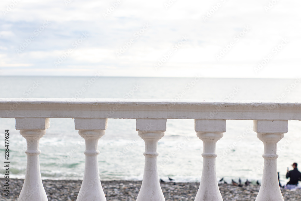Fototapeta premium White parapet on the seafront overlooking the sea