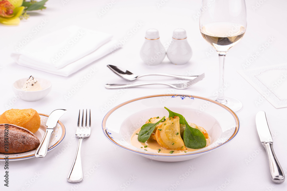 Fried meat dumplings in cheese sauce with greens Fried meat dumplings in cheese sauce with greens