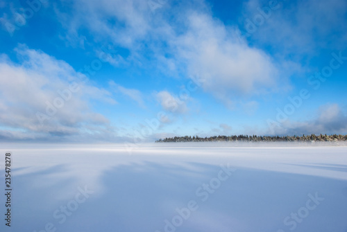 Winter sunny day on Lake Vodlozero in the Vodlozersky National Park in Karelia (Russia)