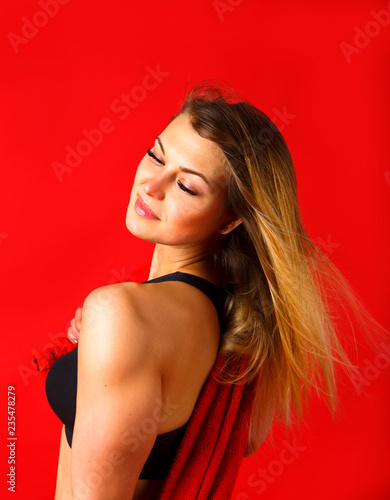 Wallpaper Mural Fitness girl is sweaty. Tired sporty girl with long white hair and red towel on her shoulders. Sport and healthy lifestyle Resting time. Side view. Red background Torontodigital.ca