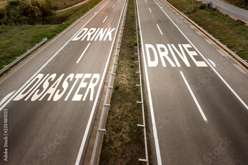 Top View on a Two line wide highway at sunset with motivational message against drinking and driving