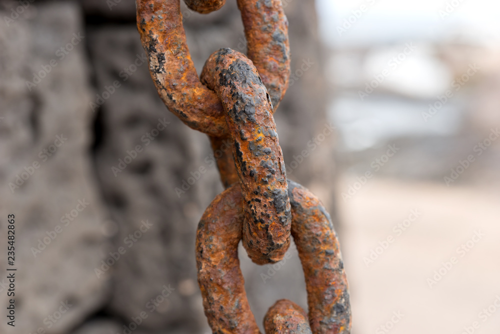 Closeup rusty chain link. Closely and inseparably connected