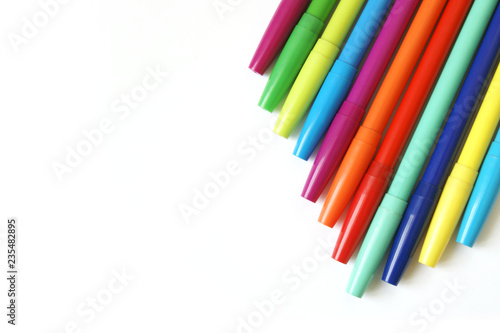 Top View of Colorful Markers on White Background