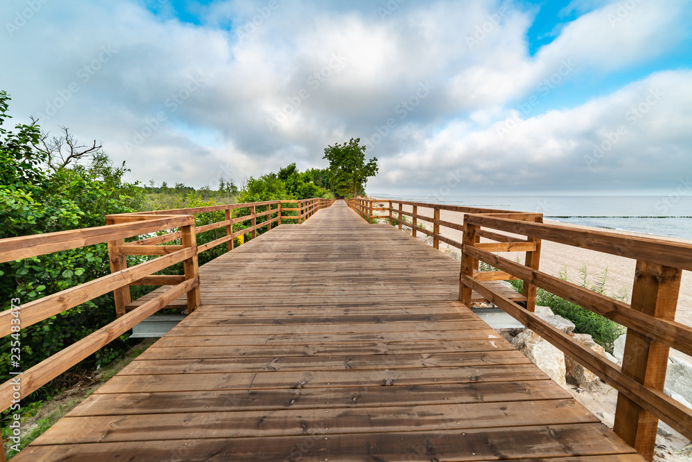 wooden path along the sea wooden path along the sea