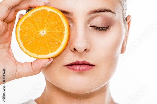 Beautiful woman with tropical fruit