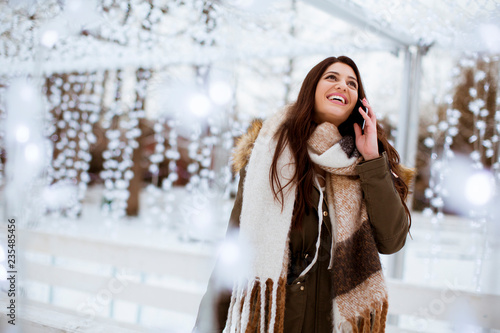 Smiling young woman with ce...