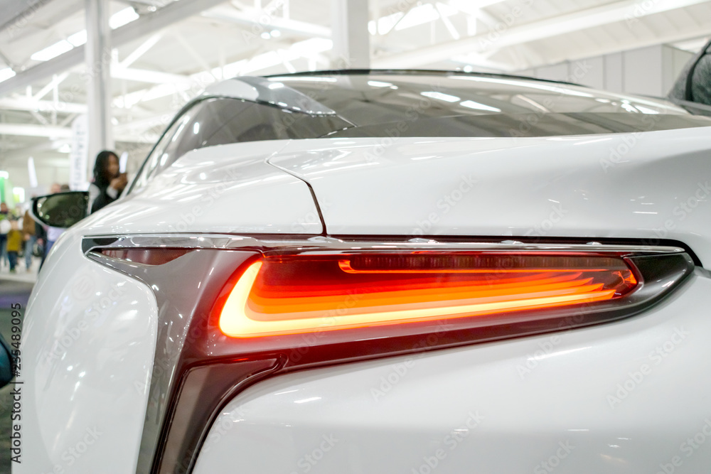 Taillight, headlight of modern prestigious luxurious car. Closeup, macro view of LED xenon car's headlamp, lamp headlight