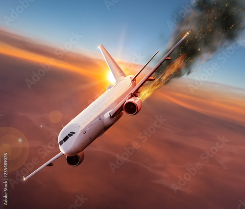 Airplane with engine on fire, concept of aerial disaster.