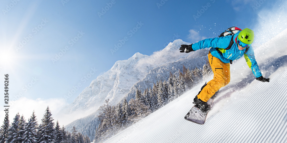 Man snowboarder riding on slope. - obrazy, fototapety, plakaty 