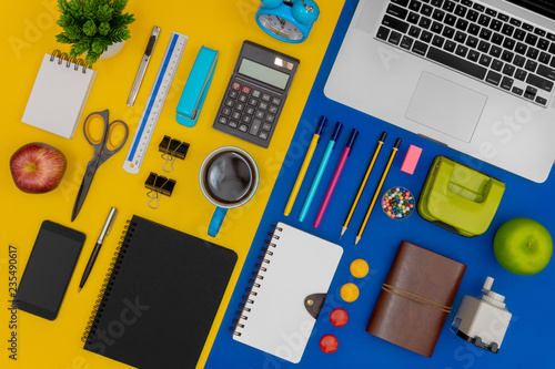 Multiple stationery items and devices for office and school. Top view flat lay of office supply.