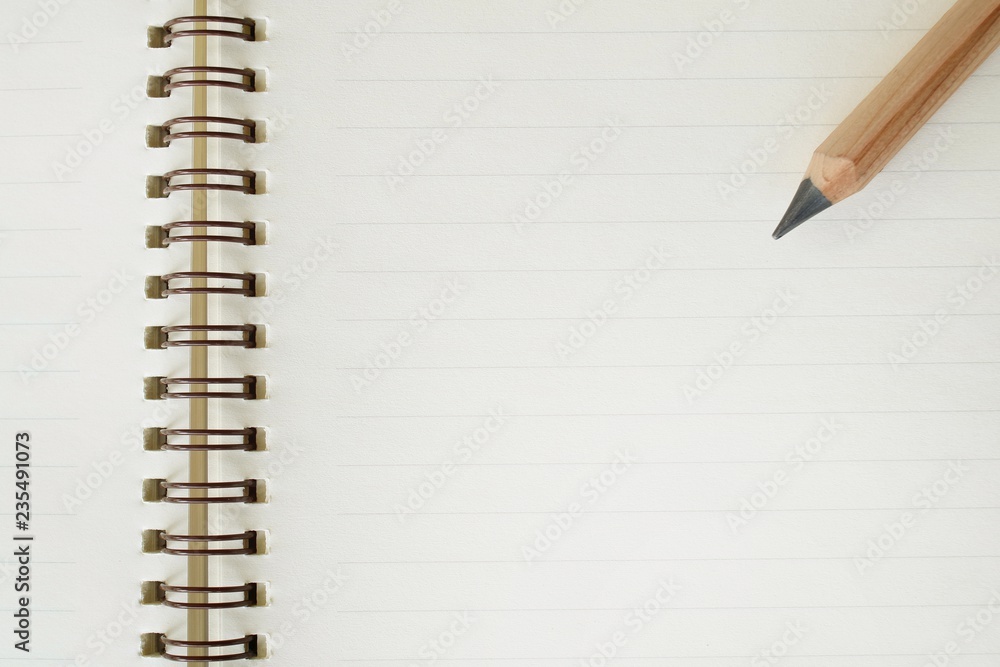 Pencil and notebook. Pencil and notebook.