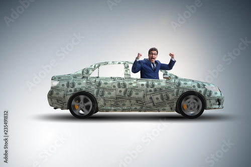 Businessman driving car covered with us dollars