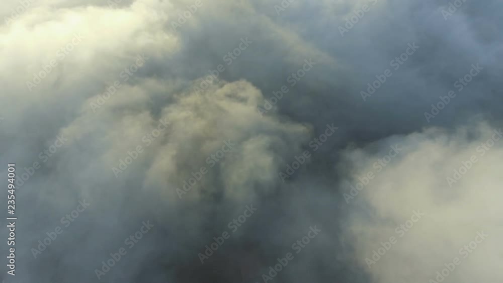 View of the clouds from the plane. flying over earth View of the clouds from the plane. flying over earth