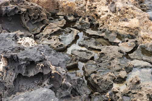 Closeup of volcanic lava stones on beach in Fuerteventura. Canary Islands