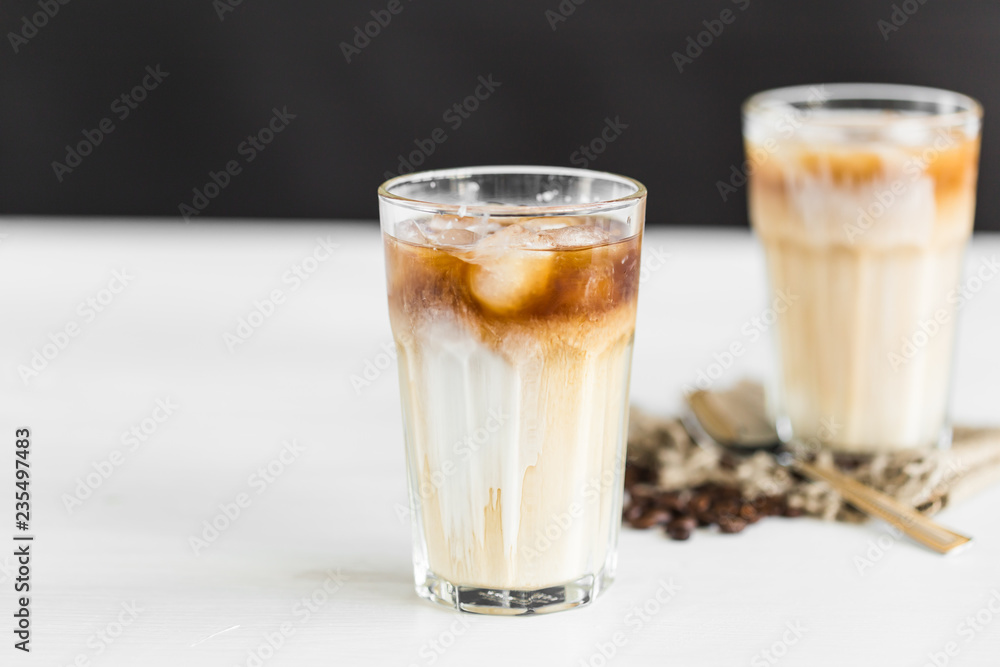 Delicious drink concept - Iced coffee in a glass with ice. Delicious drink concept - Iced coffee in a glass with ice.