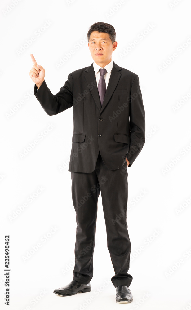 Business man in black suit standing and pointing Business man in black suit standing and pointing
