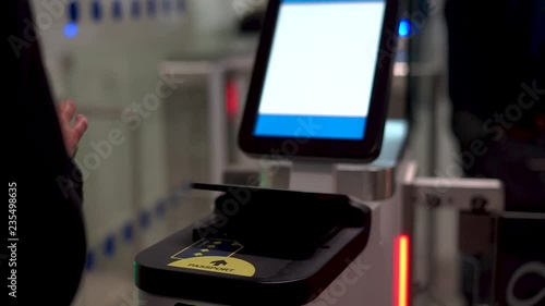 Passenger At Automated Customs Clearance Scanning passport In Airport.