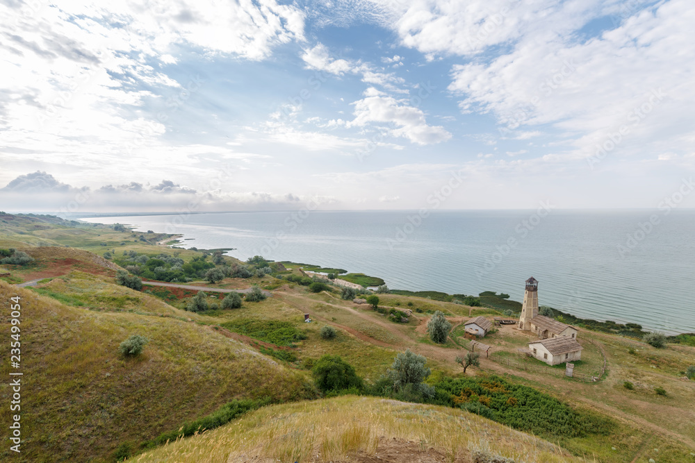 Panoramic view of the lighthouse and the Azov Sea coast near the village of Merzhanovo, Russia in the spring morning