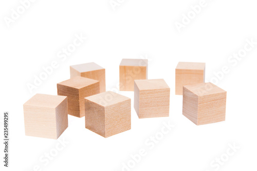 Light yellow wooden cubes on white background. Isolated on white. Business  finance  education