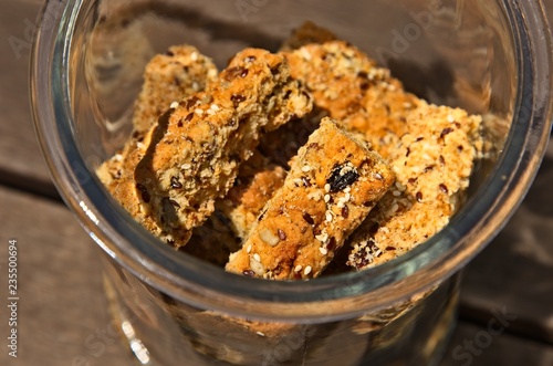 Homemade rusks in a glass jar. This is a popular South African food which is eaten with tea or coffee.  photo