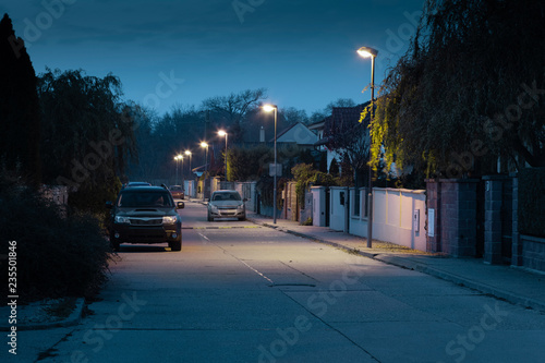 village street with modern streetlights at night