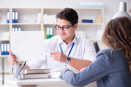 Wallpaper Mural Sales assistant discussing transaction with customer Torontodigital.ca