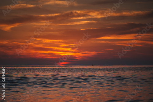 Warm beautiful evening sunset above sea, Cleopatra's beach in Alanya, Turkey