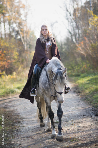 Young woman with a horse