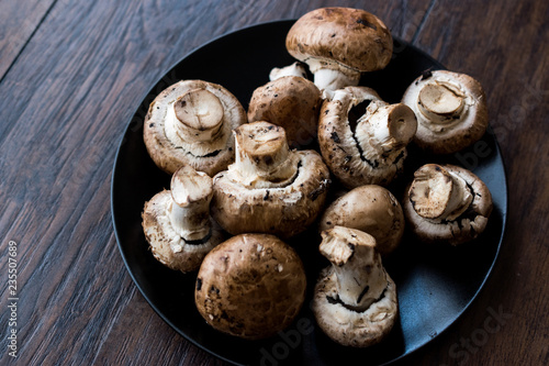 Portobello Raw Cremini Mushrooms in Black Plate.