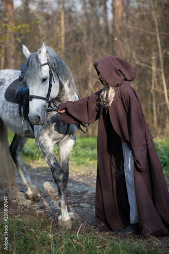 Young woman with a horse