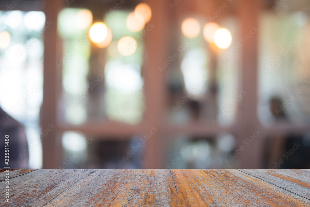 Old wooden table on front with blurred background, used for presentation product and template