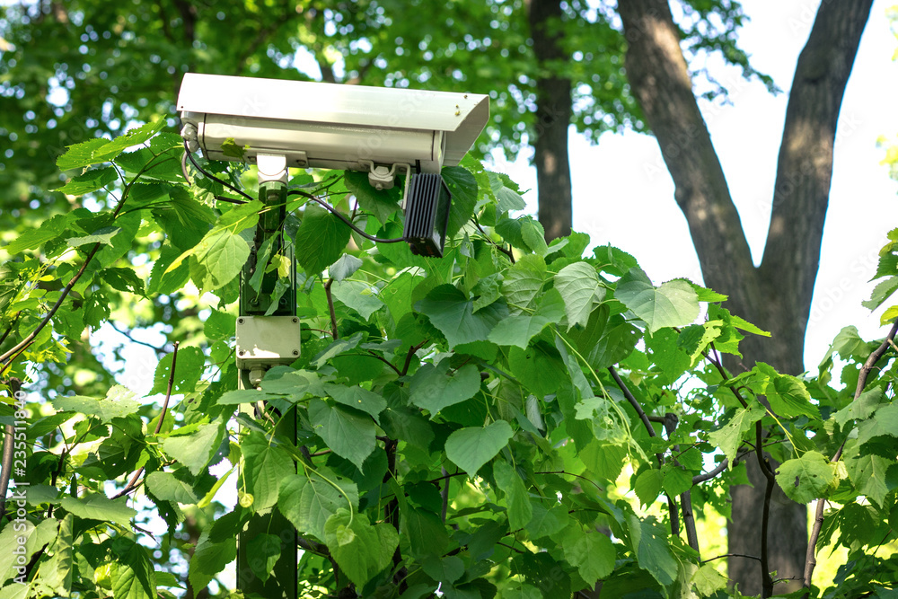 Security surveillance camera in the park Security surveillance camera in the park