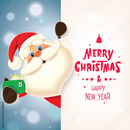 Santa Claus taking selfie next to textual Christmas signboard isolated on a sparkle blue background