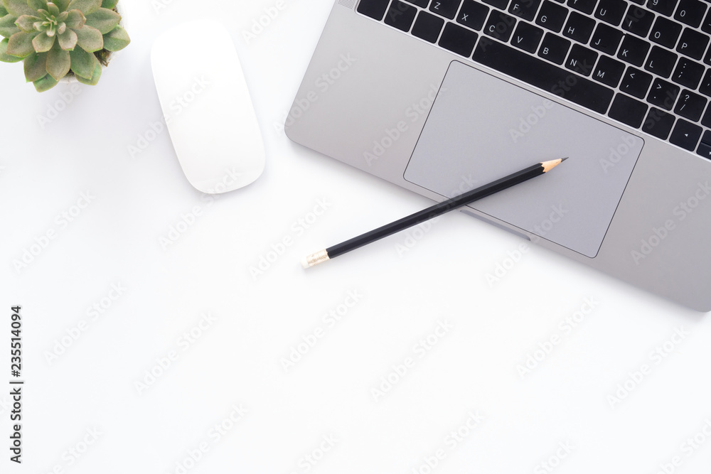 Creative flat lay photo of workspace desk. Top view office desk with laptop, glasses, pencil and plant on white color background. Top view with copy space, flat lay photography. Creative flat lay photo of workspace desk. Top view office desk with laptop, glasses, pencil and plant on white color background. Top view with copy space, flat lay photography.