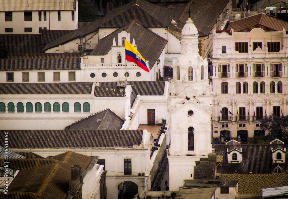Fototapeta premium Ecuadorian flag waving in the historic district of the city of Quito