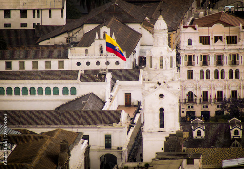 Ecuadorian flag waving in the historic district of the city of Quito photo