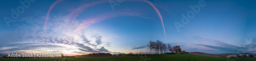 Panorama of sunrise in morning field and forest
