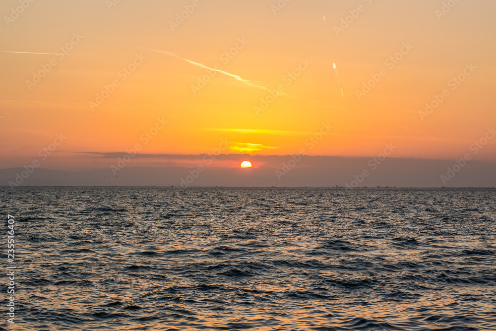 sunset sea beautiful nature evening landscape with horizon line and soft water landscape and waves