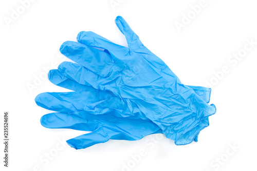 Blue latex medical and laboratory gloves on white background