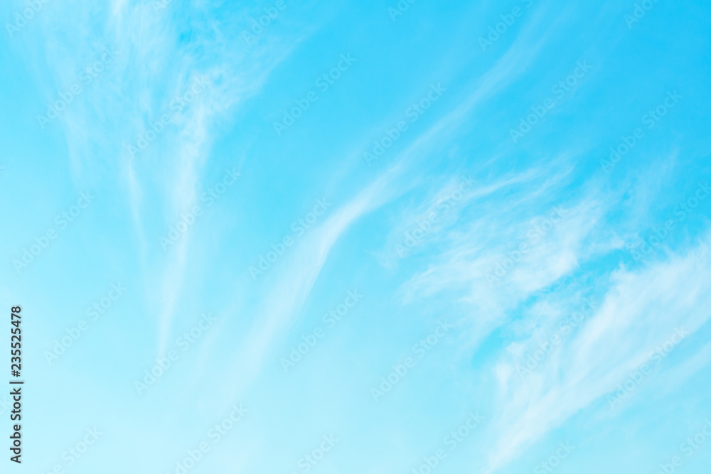 Abstract view on a white clouds in bright turquoise sky as background