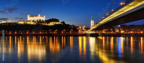 BRATISLAVA, SLOVAKIA - May 5th, 2018: Panoramic view to Bratislava castle, SNP Bridge, Hotel Devin and St. Martin cathedral across Donau in the evening