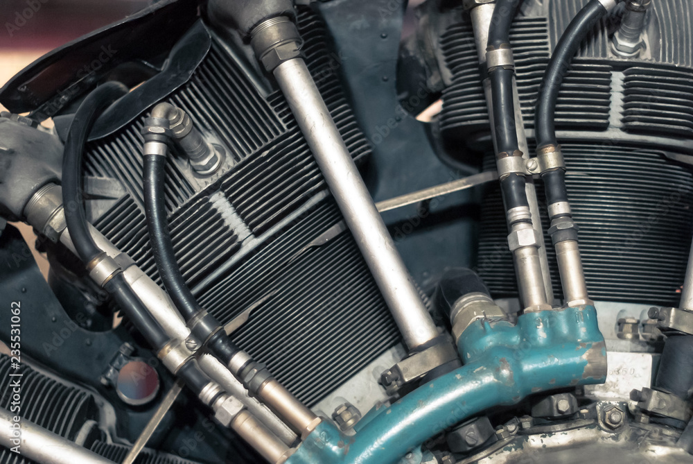 Obraz premium fragment of an radial aircraft reciprocating engine, partially blurred background