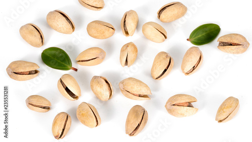 pistachios and leaf on a white background