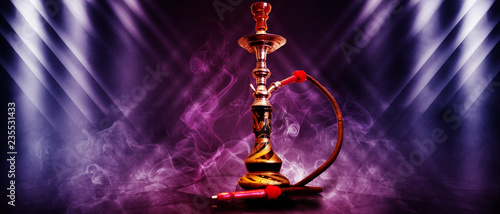 Hookah on a dark abstract background, smoke, fog, neon, concrete, rays