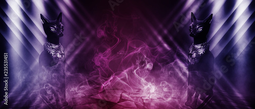 Egyptian cat goddess Bastet on a dark abstract, futuristic background, neon light, smoke, fog photo