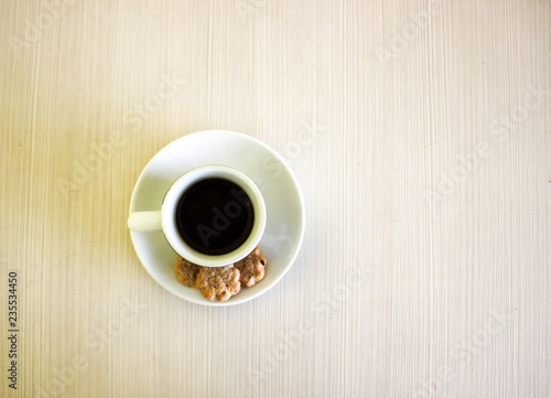 cup of coffee on wooden table, blank space for text